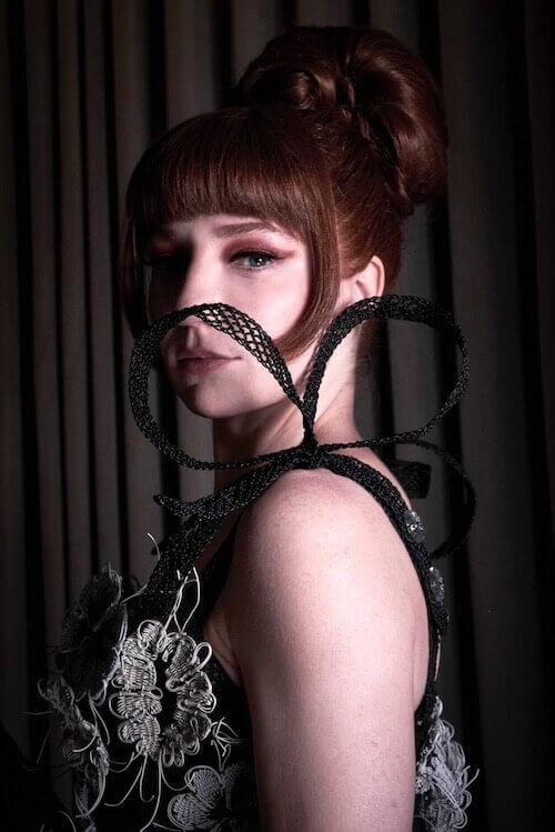 Nicola Roberts ribbon EAEC23EF-9B92-41D2-9298-E258B7425760 copy Light skinned performer Nicola Roberts models dress made from recycled electrical wire