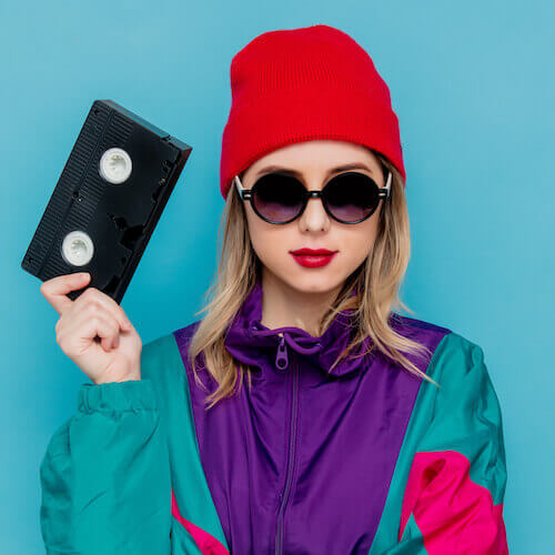 woman with VHS cassette woman with VHS cassette ready to backup video